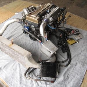 Working 2JZ-GTE engine with HKS T51R-kai turbo, exhaust manifold, F-CON V Pro, high-lift camshaft, metal gasket, injectors, and wiring harness. Fits JZA80, JZS147, and JZZ30.